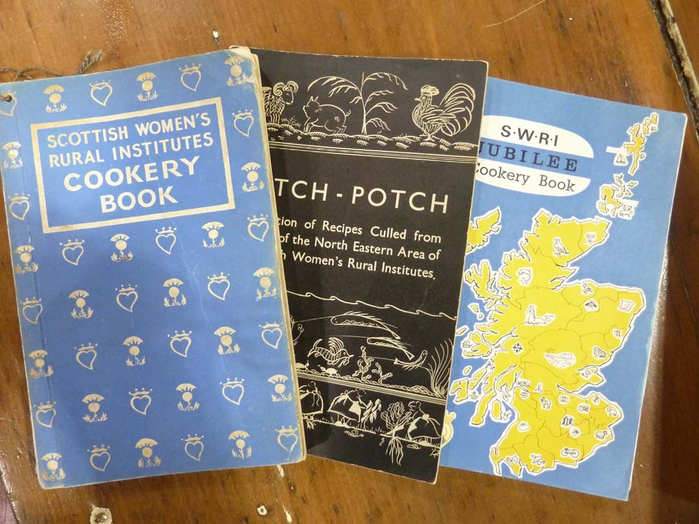 Three old, slightly worn SWRI cookbooks