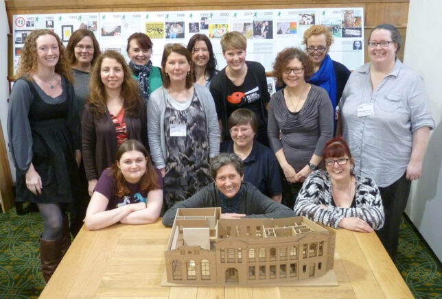 The GWL Team with a model of our future home in Bridgeton