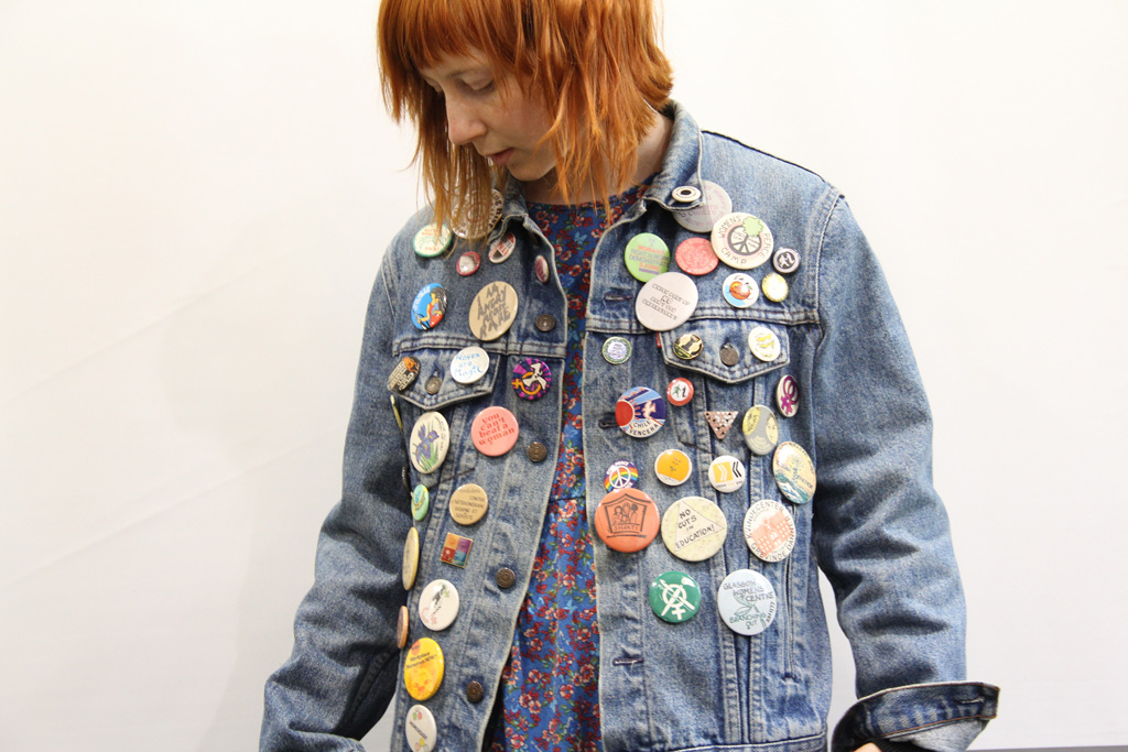 Intern Hannah wearing badges from the GWL collection