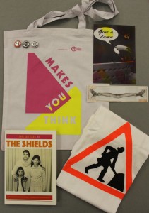Pink Tote, GWL T-Shirt (Large and Comfy!), She Settles in The Shields, Give A Damn postcard, Ruth Barker bookmark, three small GWL Badges: £15