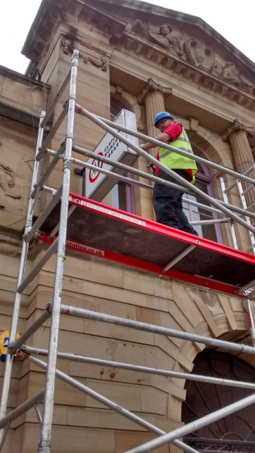 GWL sign being installed at the front of 23 Landressy Street