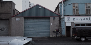 A still from the trailer of March, showing a garage.