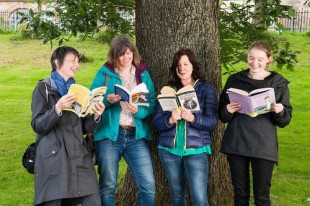 Suffragette Oak With GWL staff and volunteers reading