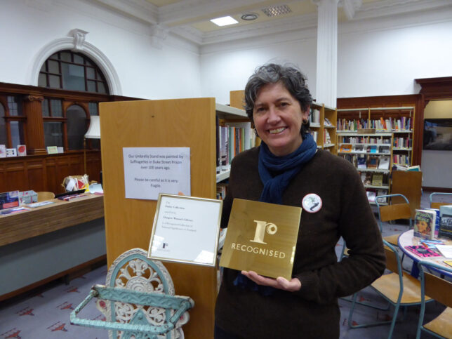 Sue John with the plaque and certificate recording our newly awared status as a Recognised Collection of National Significance