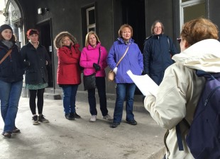 Photo of women being spoken to by guide on Women Heritage Walk