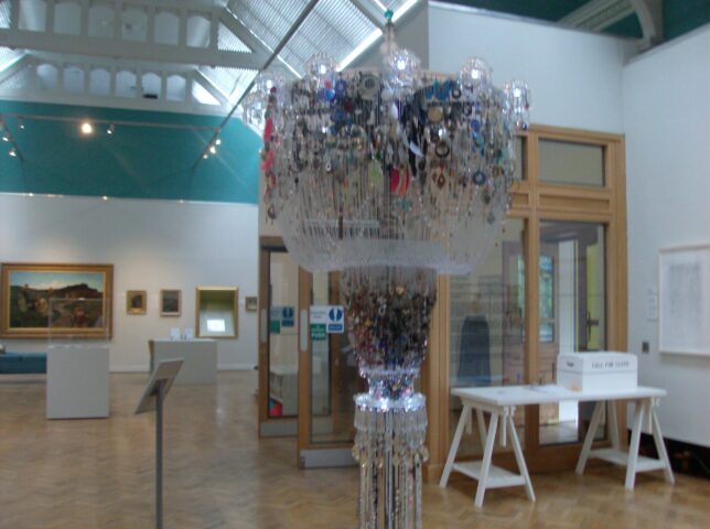 The Chandelier of Lost Earrings in the gallery space (Credit: Mary Alice)