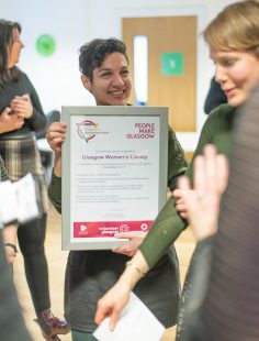 One of our volunteers with the Award Certificate
