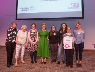 Volunteers and staff at the Awards ceremony, receiving the Finalists' certificate.