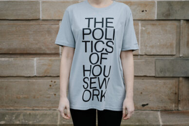 Grey t-shirt with 'The Politics of Housework' emblazoned on the front