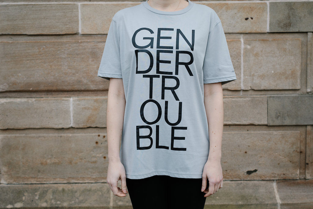 Grey t-shirt with 'Gender Trouble' emblazoned on the front