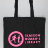 Black tote bag with bright pink text on it. It says 'Glasgow Women's Library' and 'Makes You Think' on it.