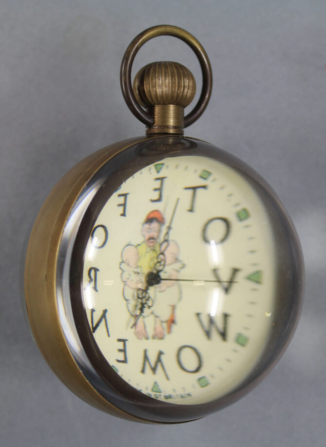 Paperweight clock seen from an angle to show its spherical shape