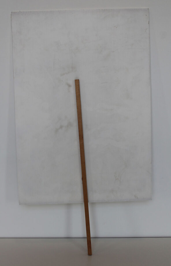 Reverse of Section 28 protest placard, white card on a narrow bamboo stick