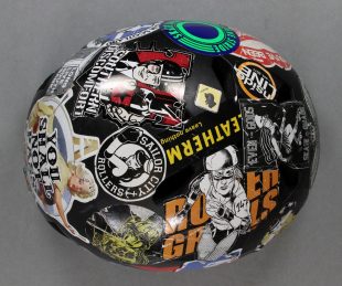 A helmet covered in stickers. From the National Museum of Roller Derby Collection. Credit: GWL.