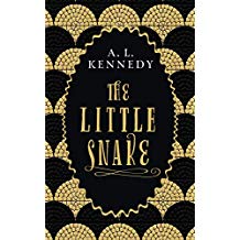 Book cover of The Little Snake by A.L. Kennedy, Winner of the Costa Book of the Year. All in gold writing except the Authors name in with capitals with gold and black scales around the edges of a crinkled edge oval with the writing inside.