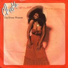 Artwork for the single. Chaka Khan is picture with a red maxi dress which hugs her figure and a large floppy hat. 