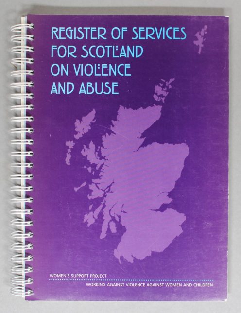 A book with a purple cover showing an image of Scotland on it.
