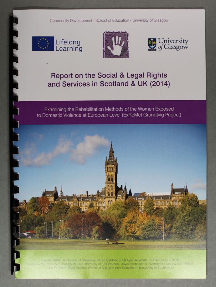 A ringbound report showing an image of a building with trees in front of it on the cover.