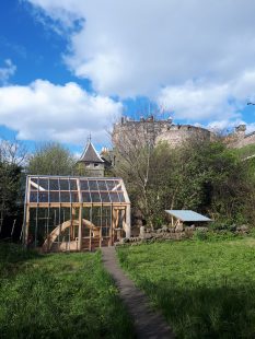 A photograph of a greenhouse. It is at Johnstone Terrace Nature Reserve, Edinburgh’s ‘Secret Garden’, where the creative writing workshops take place