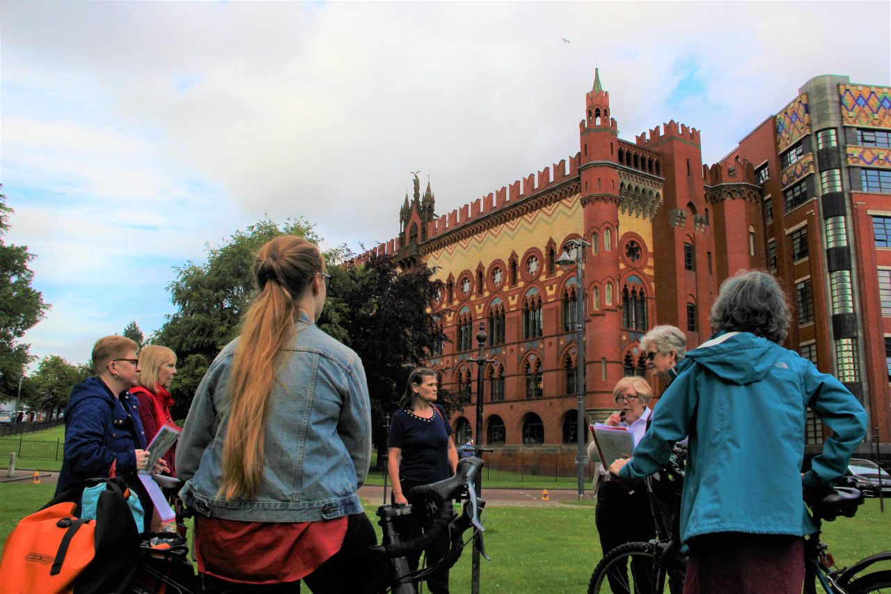 East End Women's Heritage Walk attendees outside the Templeton Building at Glasgow Green