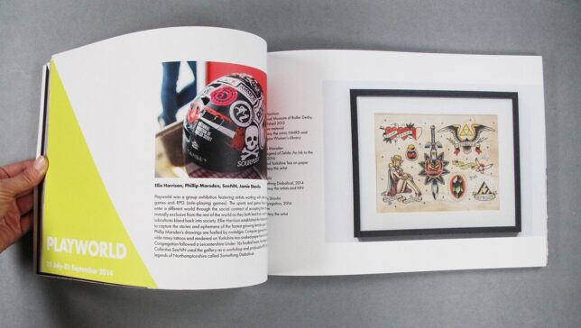 Five Years book interior pages featuring Playworld exhibition, with a photo of a roller derby helmet covered in stickers from the NMRD collection