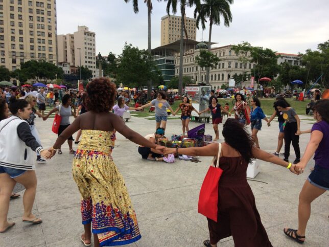 Women dancing in a circle on Praca Maua, in front of the Museo do Amanha, (Museum of Tomorrow), during Wow Festival, 17 November 2018