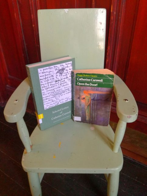 A book of selected letters by Catherine Carswell and 'Open the Door' sit on a small chair.