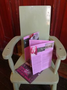 GWL's heritage walk map stands up, open, on a chair.