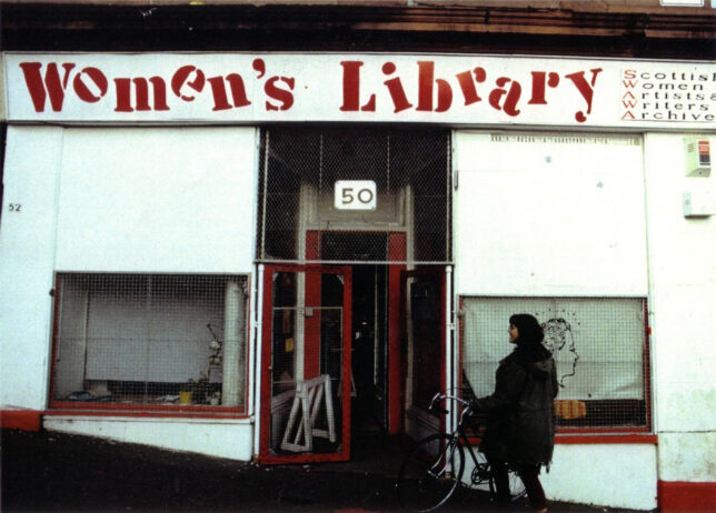 Old photograph of a shop front in Garnethil with a a sign reading Women's Library in uneven text