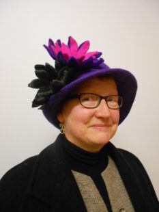 Nina Baker wearing a hat portrait