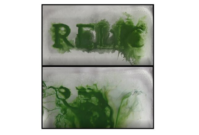 A film still shows two panels, with green ink. On one of them, the letters RELIC can just be made out as the ink is bleeding and blurring away.