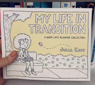 Image shows cover of My Life in Transition. Illustration of Julia Kaye sitting on a bench writing and watching a butterfly. Picture is taken against the backdrop of a bookcase.