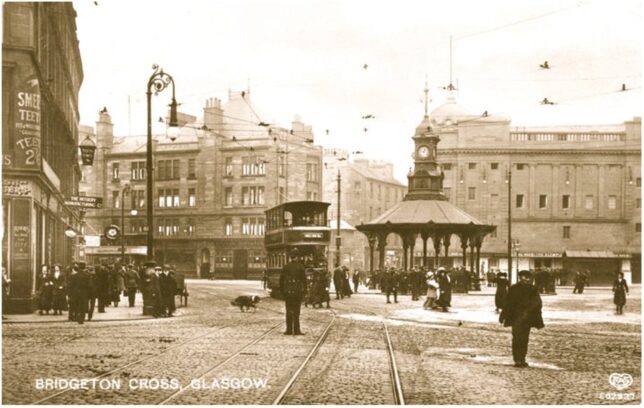 Image of Bridgeton Cross, taken around 1912. The image shows the street and the tram line through the area. It is intended to highlight the grandeur of the area to show its wealth during its industrial peak.