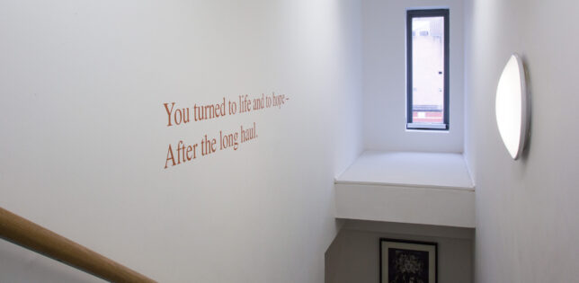 The stairway to our archive mezzanine, with words by Jackie Kay.