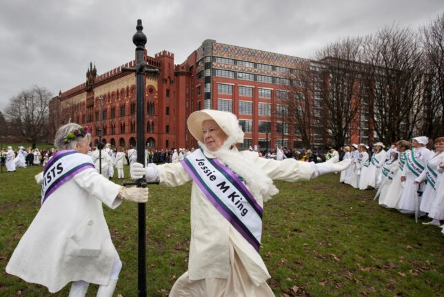 A still from March showing GWL staff and volunteers dressed in suffragette clothing