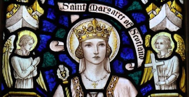 A stained-glass depiction of Saint Margaret of Scotland where she is depicted with a halo and surrounded by angels.