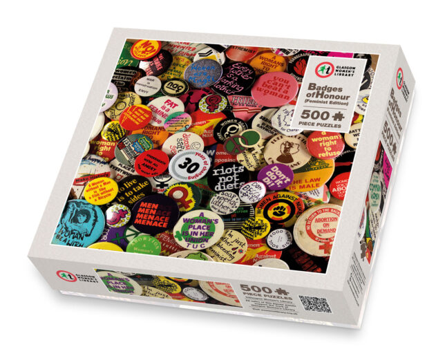 Illustration of the Badges of Honour Jigsaw (Feminist Edition) box, with an inset photo of many brightly coloured feminist slogans