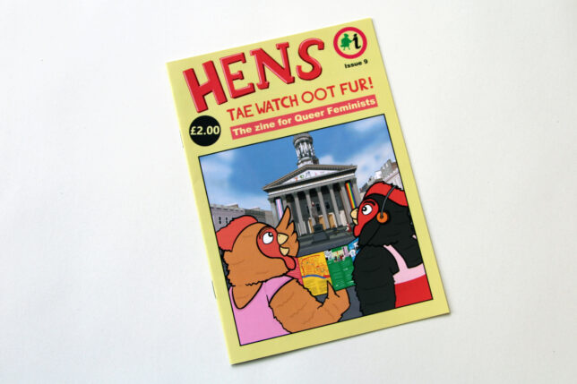 The cover of Hens zine, featuring an illustration of two hens holding a copy of a colorful leaflet stood in front of Glasgow's Gallery of Modern Art.