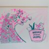 A dark green and neon pink wave lifts a little character into a pink tea cup with the words “Home Sweet Home” written on it. There are pink sunshine rays coming from the top left corner.