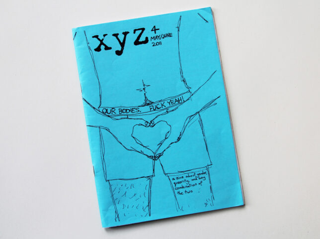 Photo showing the cover of xyz zine. It features an illustration in black on bright blue paper of a torso. The hands are held in a heart shape over the crotch.
