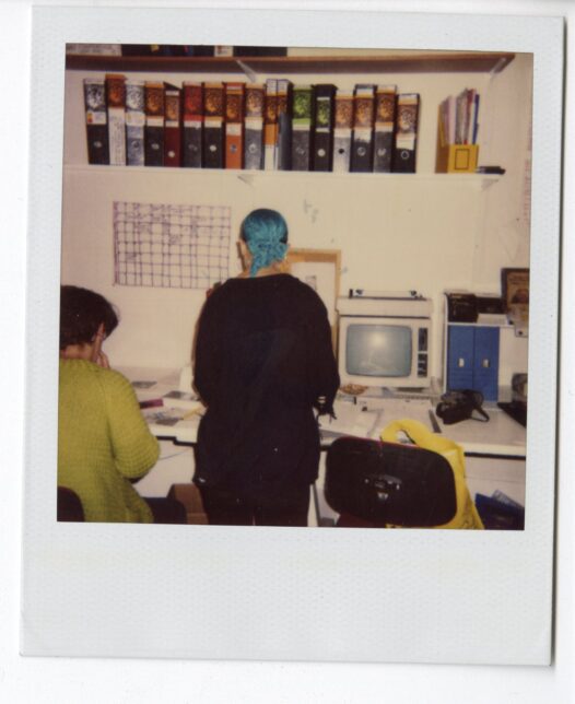 Polaroid of a GWL volunteer working in the Garnethill space