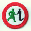 Circular patch with the GWL logo of a walking woman in green and an 'i; for information, surrounded by a red circle