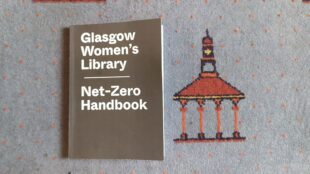 A copy of GWL's Net Zero Handbook placed on the Library's carpet which features the Bridgeton Umbrella