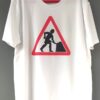 White T-shirt with the Women at Work' logo, featuring a stylised woman digging
