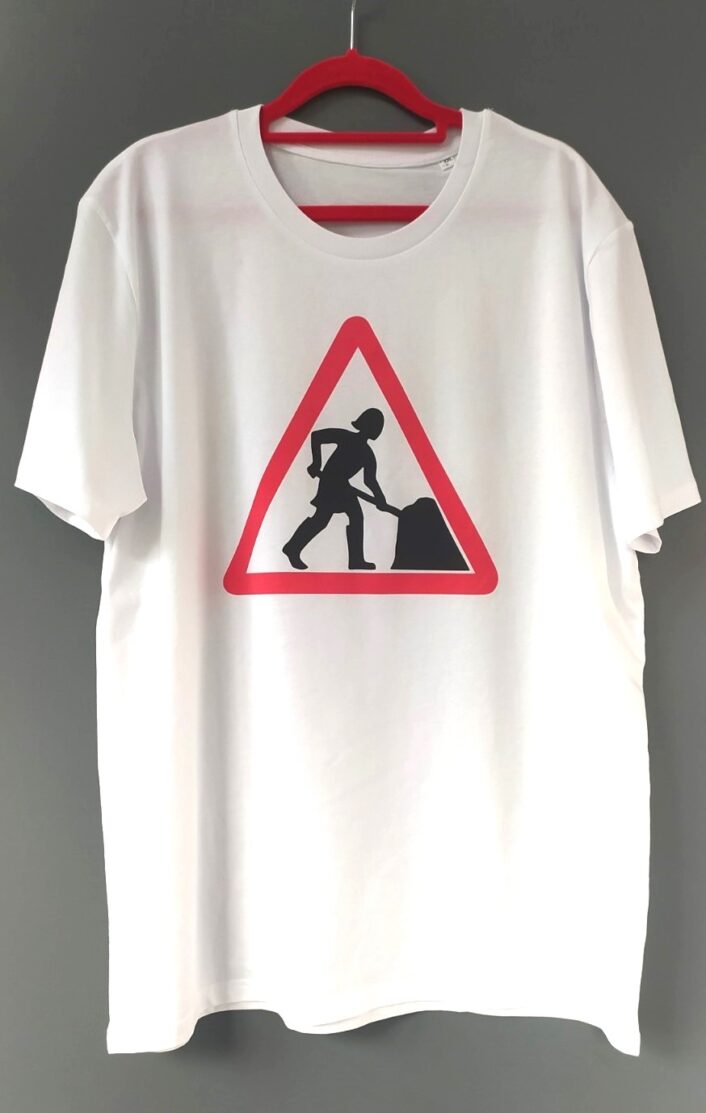 White T-shirt with the Women at Work' logo, featuring a stylised woman digging