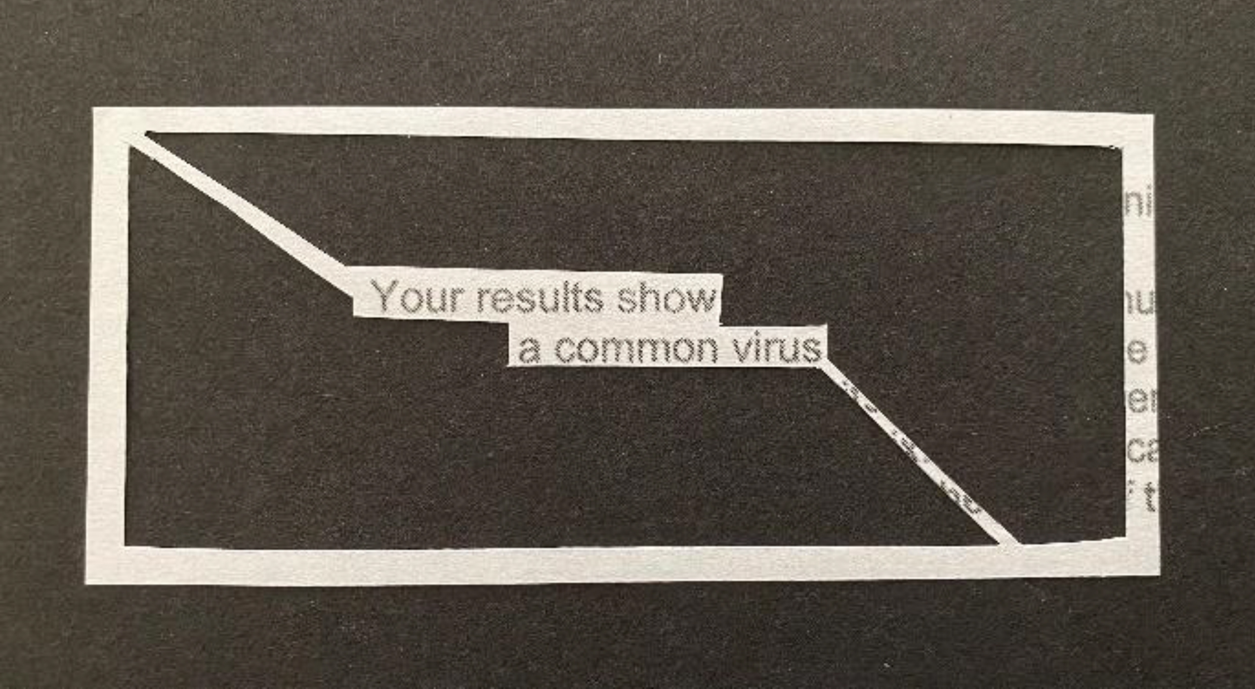 Black background with cut-out white pattern. Black text reading- Your results are a common virus