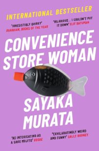 Purple background with bold white writing and a fish shaped plastic soy sauce capsule (the kind you get with takeaway sushi).