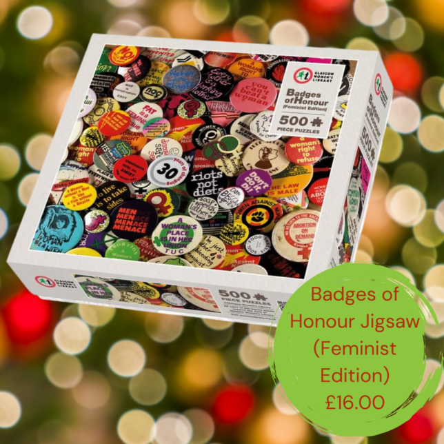 A jigsaw box for the Badges of Honour jigsaw. To the right is a green circle with red text which reads Badges of Honour Jogsaw (feminist edition) £16
