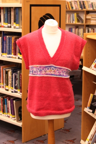 A pink jumper in the main library space.