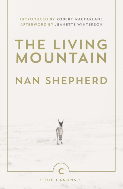 A white book cover with the text The Living Mountain, Nan Shepherd and a young deer standing in snow.